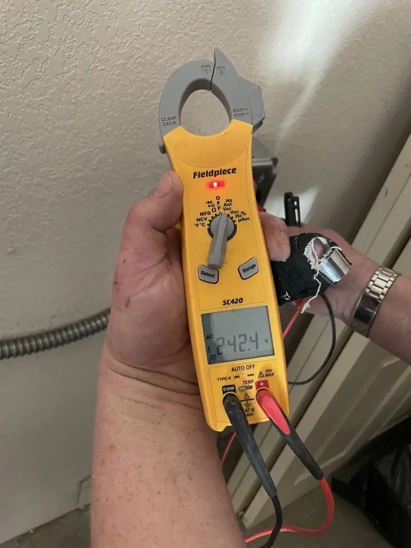 Voltage testing with clamp meter during Electrical Installation Services in Adelanto